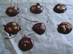 chocolate discs on greaseproof paper