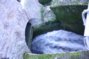 Water gushing through open sluice gate